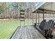 The boat dock features seating and a ladder for enjoying the waterfront at 3795 Duckcove Way, Cumming, GA 30041