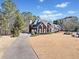 A beautiful brick house featuring an inviting driveway and sprawling green lawn at 3795 Duckcove Way, Cumming, GA 30041