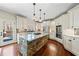 Gourmet kitchen with a stone island, stainless steel appliances, and custom cabinetry at 3795 Duckcove Way, Cumming, GA 30041