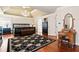 Spacious main bedroom features a decorative ceiling, hardwood floors, a chandelier and lots of furniture at 3795 Duckcove Way, Cumming, GA 30041