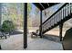 This backyard patio area offers outdoor seating and access to the upper deck stairs at 3795 Duckcove Way, Cumming, GA 30041