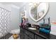 This colorful bathroom is designed with a heart mirror, fish tank, and black granite counters at 447 Lacy Rd, Canton, GA 30115
