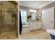 A modern bathroom featuring a glass shower, tiled floor, single sink, and a window at 447 Lacy Rd, Canton, GA 30115