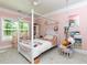 Bright bedroom with a four-poster bed and a hanging swing chair at 447 Lacy Rd, Canton, GA 30115