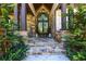 Inviting front entrance featuring stone accents, mature landscaping, and a stylish door with elegant design elements at 447 Lacy Rd, Canton, GA 30115