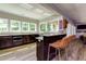 Stylish kitchen features dark cabinetry, granite countertops, stainless steel appliances, and a breakfast bar with seating at 447 Lacy Rd, Canton, GA 30115