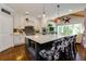 Stylish kitchen featuring a large island with seating, pendant lights, and stainless steel appliances at 447 Lacy Rd, Canton, GA 30115