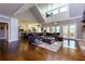 Open-concept living area featuring a high vaulted ceiling, hardwood floors, and French doors to the outside at 447 Lacy Rd, Canton, GA 30115