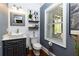 Chic powder room with shiplap walls, stylish mirror, vessel sink, and modern fixtures at 447 Lacy Rd, Canton, GA 30115