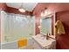 Cozy bathroom featuring a bathtub, vanity, and tile surround at 857 Dill Sw Ave, Atlanta, GA 30310