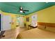 Bedroom with hardwood floors, ceiling fan, and a sliding barn door to bathroom at 857 Dill Sw Ave, Atlanta, GA 30310