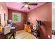 Cozy room with hardwood floors, ceiling fan, and guitars at 857 Dill Sw Ave, Atlanta, GA 30310
