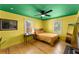 Bright bedroom featuring hardwood floors, ceiling fan, and natural light at 857 Dill Sw Ave, Atlanta, GA 30310