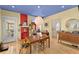 Bright dining room featuring a decorative fireplace, light fixture, and hardwood floors at 857 Dill Sw Ave, Atlanta, GA 30310