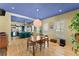 Open-concept dining room with hardwood floors, adjacent to a modern kitchen with ample seating at 857 Dill Sw Ave, Atlanta, GA 30310