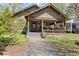 Charming craftsman home with a welcoming front porch, landscaped yard, and inviting curb appeal at 857 Dill Sw Ave, Atlanta, GA 30310