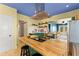 Kitchen with a butcher block island, stainless appliances, and a view of the living room at 857 Dill Sw Ave, Atlanta, GA 30310