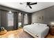 Primary bedroom with hardwood floors, natural light, and built in storage at 857 Dill Sw Ave, Atlanta, GA 30310