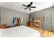 Primary bedroom boasting a decorative fireplace, hardwood floors, and modern aesthetic at 857 Dill Sw Ave, Atlanta, GA 30310