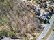 An aerial view shows a large lot surrounded by established homes in neighborhood at 1734 Summit Glen, Atlanta, GA 30329