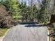 Aerial view showcasing the paved driveway amidst lush trees and greenery at 1734 Summit Glen, Atlanta, GA 30329