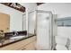 Bathroom featuring a stand-up shower and black granite countertop sink at 1791 Harper Nw St # H, Atlanta, GA 30318