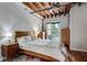 Bright bedroom with hardwood floors, large windows, and a comfortable bed at 1791 Harper Nw St # H, Atlanta, GA 30318