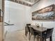 Minimalist dining area with modern table and chairs, featuring contemporary artwork at 1791 Harper Nw St # H, Atlanta, GA 30318