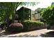 Two-story home featuring verdant landscaping, a balcony, and modern design elements on a tree-lined street at 1791 Harper Nw St # H, Atlanta, GA 30318