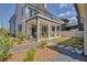 Beautiful backyard with covered patio, outdoor seating, and manicured landscaping at 250 4Th St, Fayetteville, GA 30214