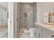 Modern bathroom featuring glass-enclosed shower with gray subway tile and a floating vanity at 250 4Th St, Fayetteville, GA 30214