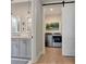 Well lit, modern bathroom with a sliding door to a laundry room with washer and dryer at 250 4Th St, Fayetteville, GA 30214