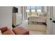 Cozy bedroom with soft rug, lots of light, sitting chair, and door to exterior at 250 4Th St, Fayetteville, GA 30214
