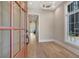 Elegant foyer featuring hardwood floors, chandelier, and large windows, creating a bright and welcoming entrance at 250 4Th St, Fayetteville, GA 30214