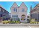 Charming two-story home with white brick, an arched entry, manicured landscaping and welcoming curb appeal at 250 4Th St, Fayetteville, GA 30214