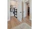 Two walk-in closets can be seen from the doorway and a hardwood floor and area rug are also visible at 250 4Th St, Fayetteville, GA 30214