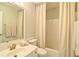Clean bathroom with neutral decor featuring a shower/tub combo and vanity with sink at 2593 Abbotts Glen Nw Dr, Acworth, GA 30101