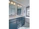 Modern bathroom featuring double vanity, soaking tub, and beautiful tile work at 2593 Abbotts Glen Nw Dr, Acworth, GA 30101