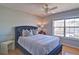 Comfortable bedroom with a plush bed, natural light, and hardwood floors at 2593 Abbotts Glen Nw Dr, Acworth, GA 30101