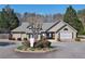 Exterior view of community clubhouse with attractive landscaping and well-maintained grounds at 2593 Abbotts Glen Nw Dr, Acworth, GA 30101