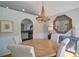 Charming dining room featuring a wooden table, chandelier, and wainscoting, creating a welcoming space at 2593 Abbotts Glen Nw Dr, Acworth, GA 30101