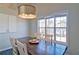 Cozy dining room features a wooden table and modern light fixture at 2593 Abbotts Glen Nw Dr, Acworth, GA 30101