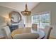 Charming dining room features a rustic wood table and elegant light fixture at 2593 Abbotts Glen Nw Dr, Acworth, GA 30101