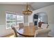 Cozy dining room features a chandelier and view of the backyard at 2593 Abbotts Glen Nw Dr, Acworth, GA 30101