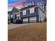 Charming two-story home with a well-manicured lawn and an attached two-car garage at 2593 Abbotts Glen Nw Dr, Acworth, GA 30101