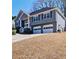 Charming two-story home with a well-manicured lawn and an attached two-car garage at 2593 Abbotts Glen Nw Dr, Acworth, GA 30101