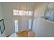 Bright foyer with hardwood floors, ample natural light, and a stylish pendant light, creating a grand entrance at 2593 Abbotts Glen Nw Dr, Acworth, GA 30101