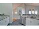 Bright kitchen with granite countertops, stainless steel appliances and view to the second floor at 2593 Abbotts Glen Nw Dr, Acworth, GA 30101