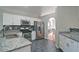 Modern kitchen with stainless steel appliances, granite countertops, and ample cabinet space, perfect for cooking at 2593 Abbotts Glen Nw Dr, Acworth, GA 30101