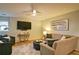 Cozy living room with comfortable seating, TV, and soft natural light at 2593 Abbotts Glen Nw Dr, Acworth, GA 30101
